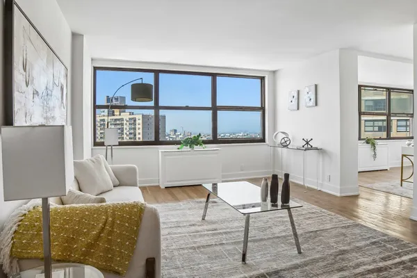a living room with furniture and a large window
