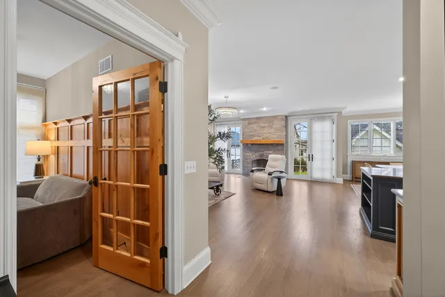 a large kitchen with a table and chairs