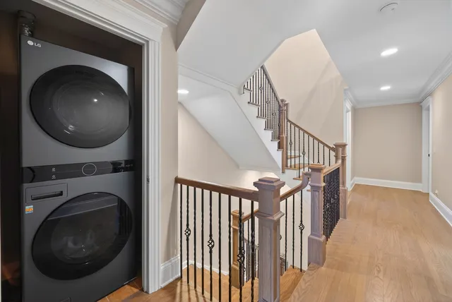 a bathroom with a granite countertop double vanity sink a mirror and shower