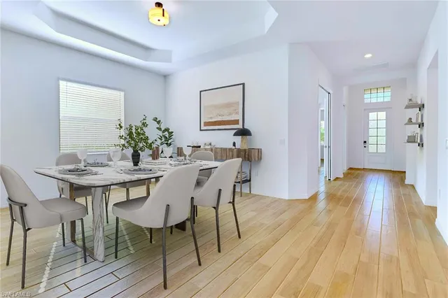 a view of a dining room with furniture and wooden floor