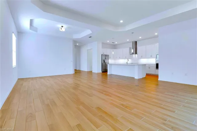 a view of kitchen and kitchen with microwave