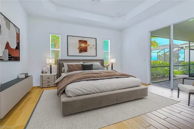 a bedroom with a bed a couch and a window