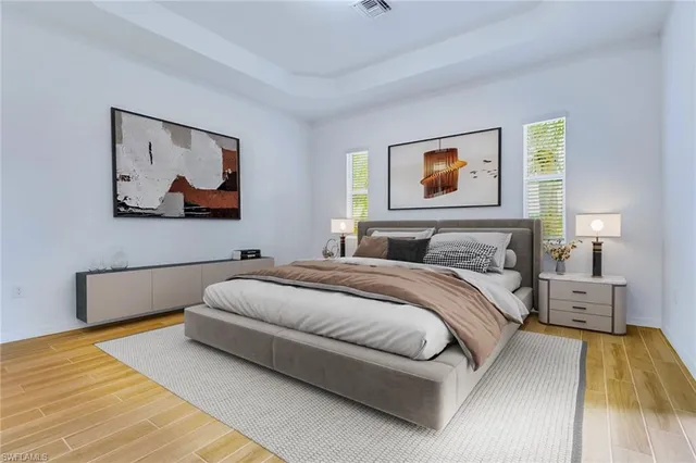 a bedroom with a bed and wall painting