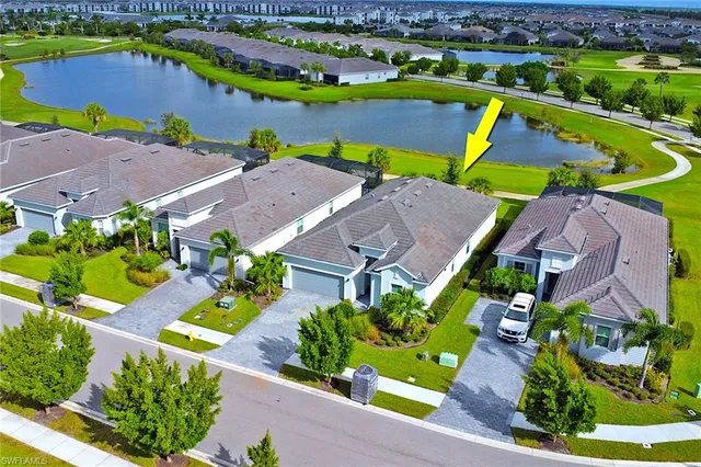 an aerial view of a house with a garden and swimming pool