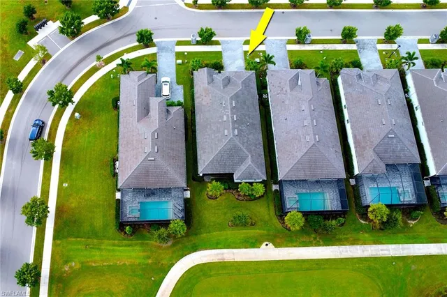 an aerial view of multiple houses with outdoor space