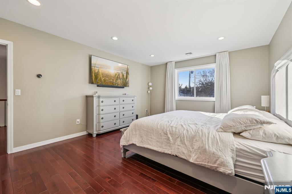 17 Maple Avenue Mahwah, NJ 07430 - Photo 22 of 36 a bedroom with a bed and a flat screen tv