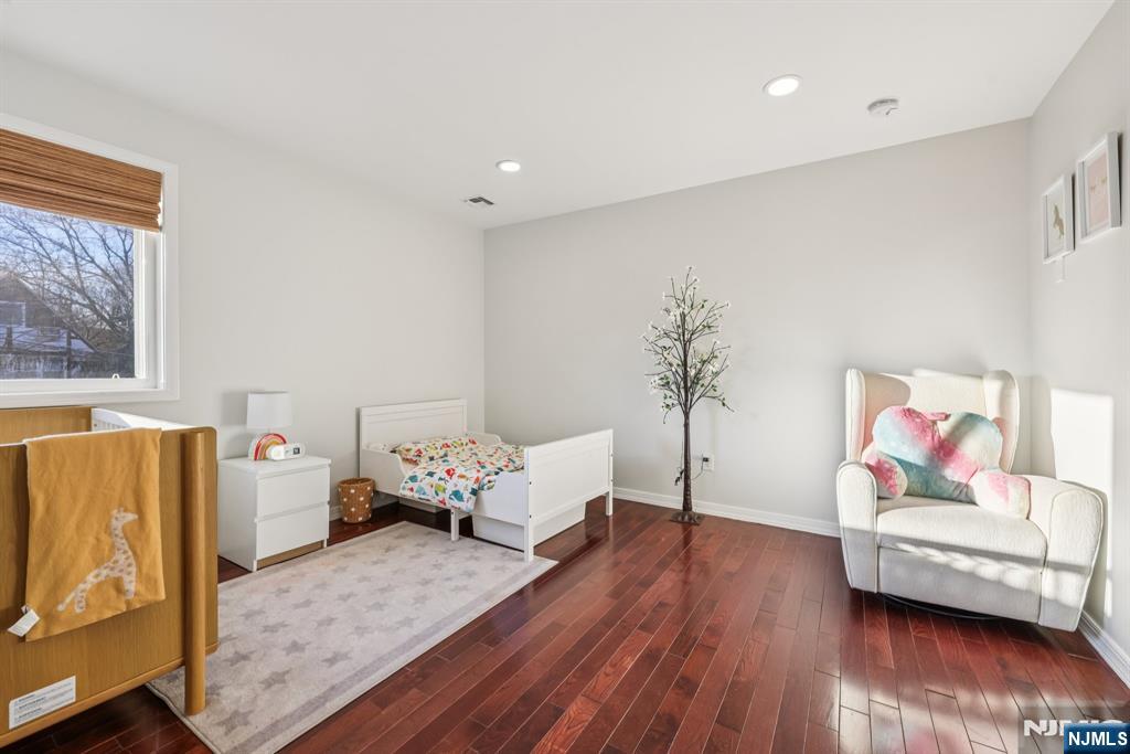 17 Maple Avenue Mahwah, NJ 07430 - Photo 23 of 36 a living room with furniture and a wooden floor