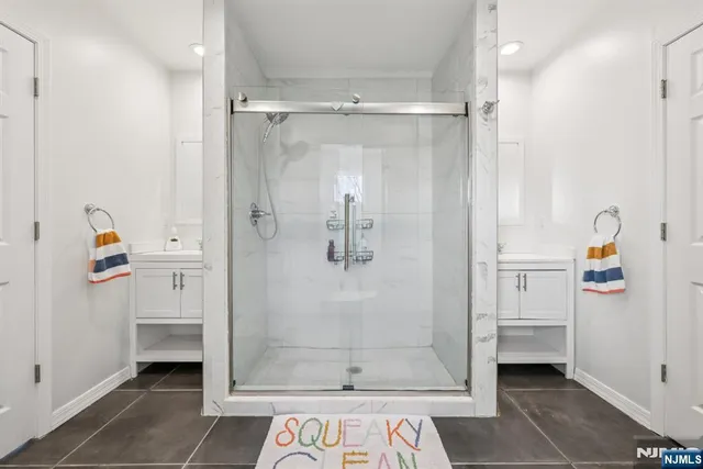 a bathroom with a shower and a sink