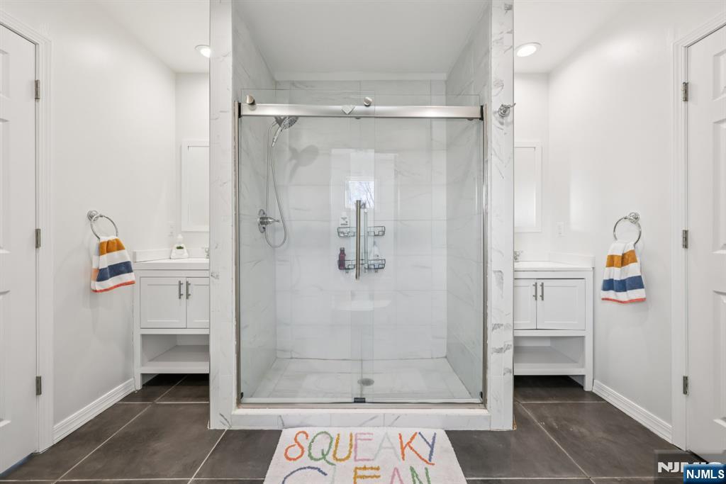 17 Maple Avenue Mahwah, NJ 07430 - Photo 25 of 36 a bathroom with a shower and a sink