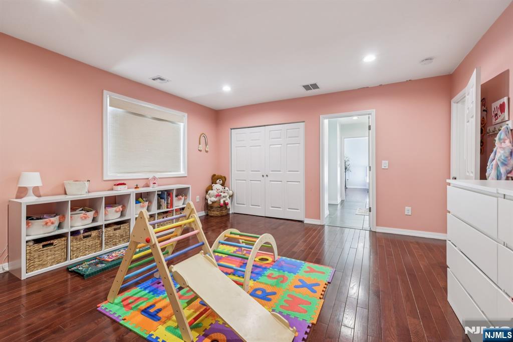 17 Maple Avenue Mahwah, NJ 07430 - Photo 27 of 36 a very nice looking living room with furniture and a book shelf