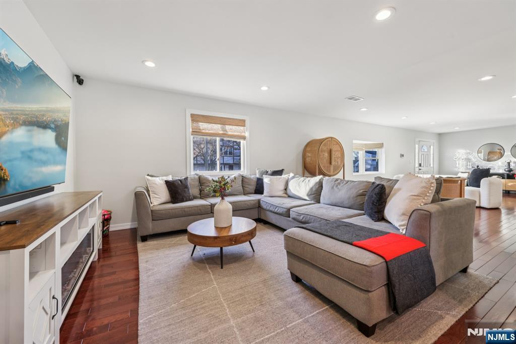 17 Maple Avenue Mahwah, NJ 07430 - Photo 8 of 36 a living room with furniture and a flat screen tv