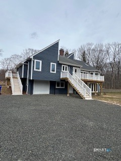 44 Chamberlain Hill Road Middletown, CT 06457 - Photo 2 of 40 a front view of a house with a yard and garage