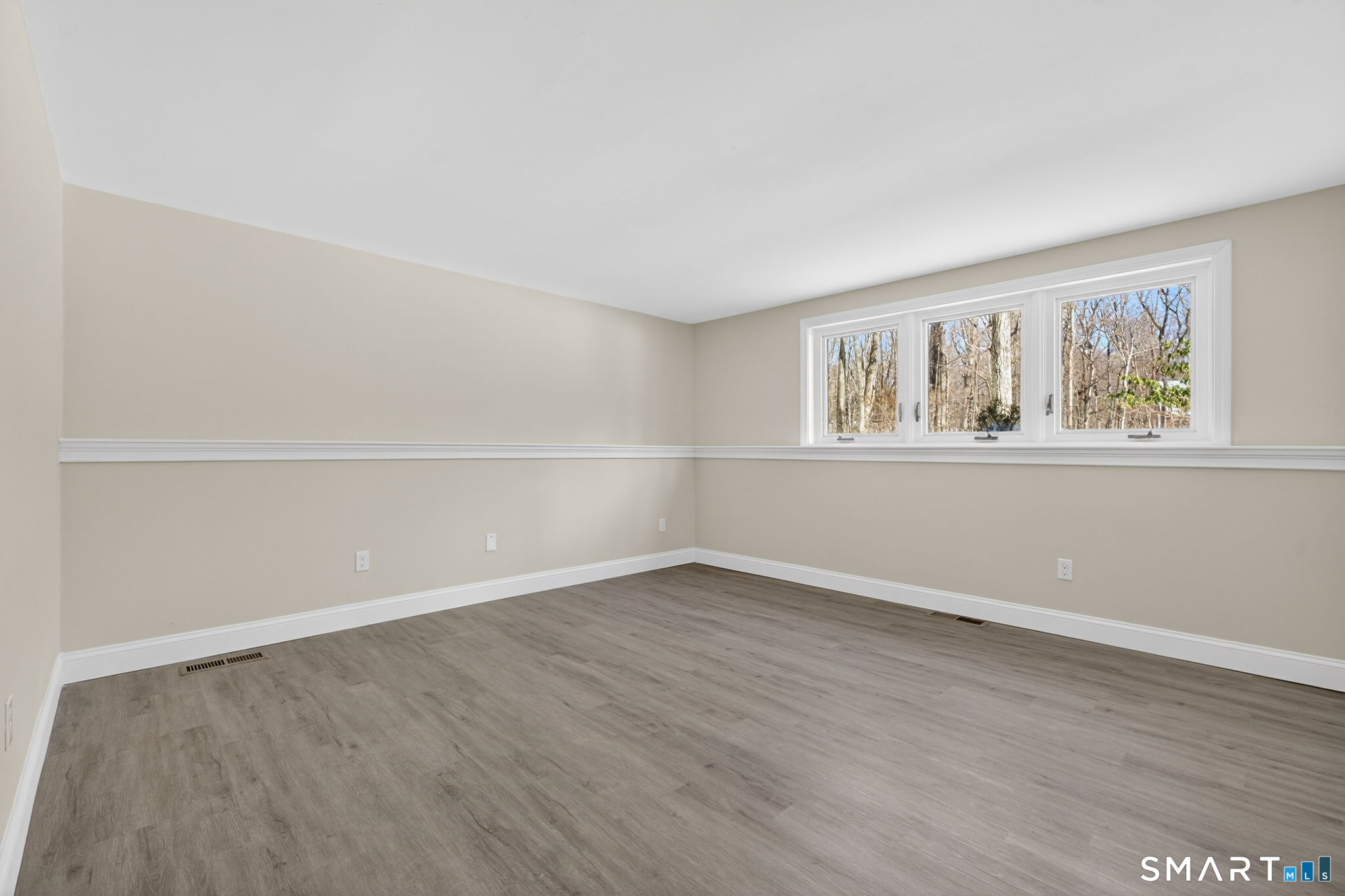 44 Chamberlain Hill Road Middletown, CT 06457 - Photo 21 of 40 an empty room with wooden floor and windows