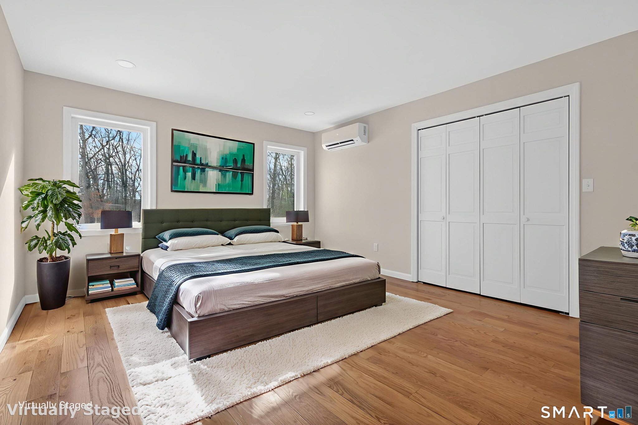 44 Chamberlain Hill Road Middletown, CT 06457 - Photo 34 of 40 a bedroom with a large bed and a potted plant