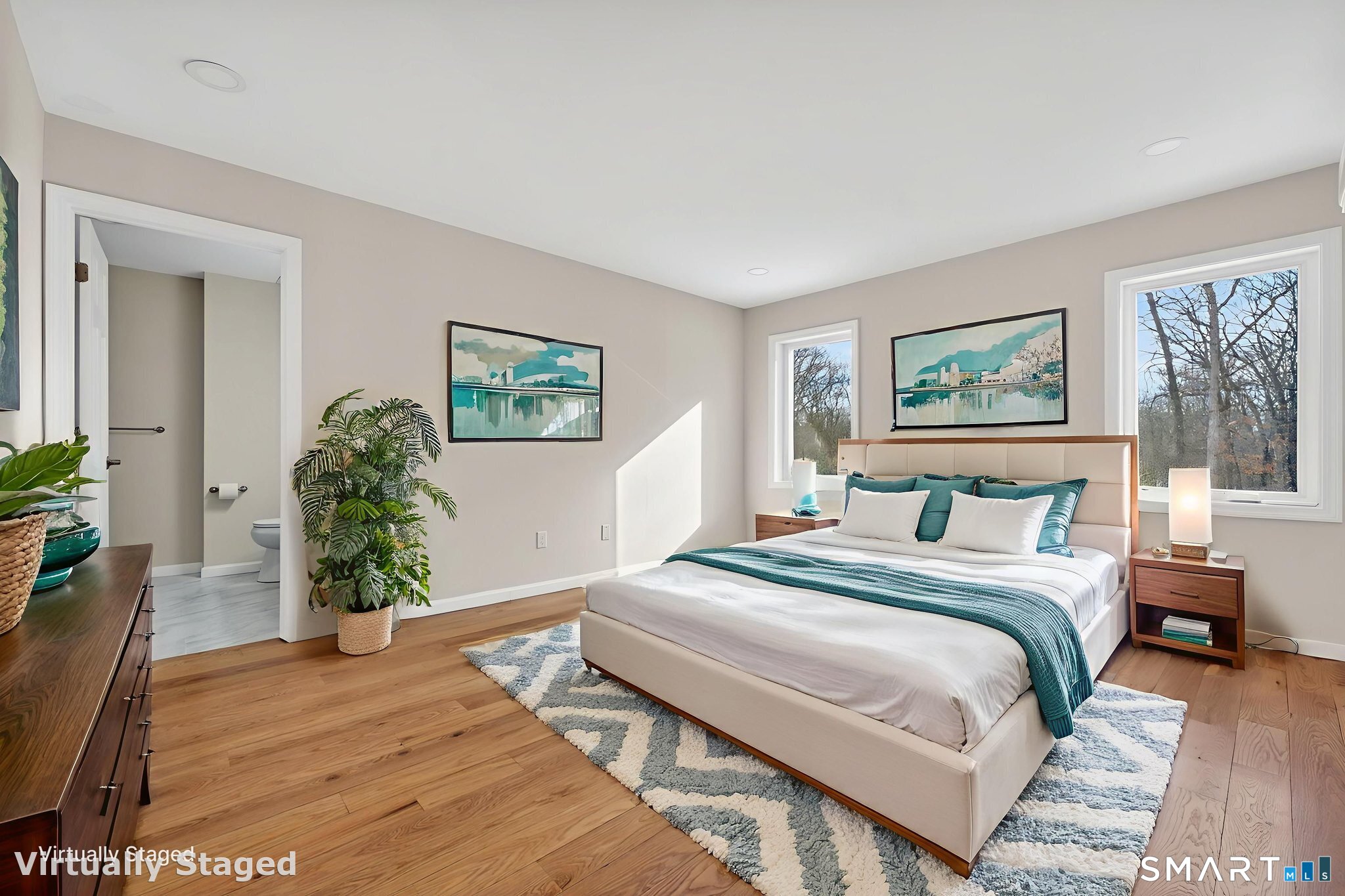 44 Chamberlain Hill Road Middletown, CT 06457 - Photo 36 of 40 a bedroom with a bed and a potted plant