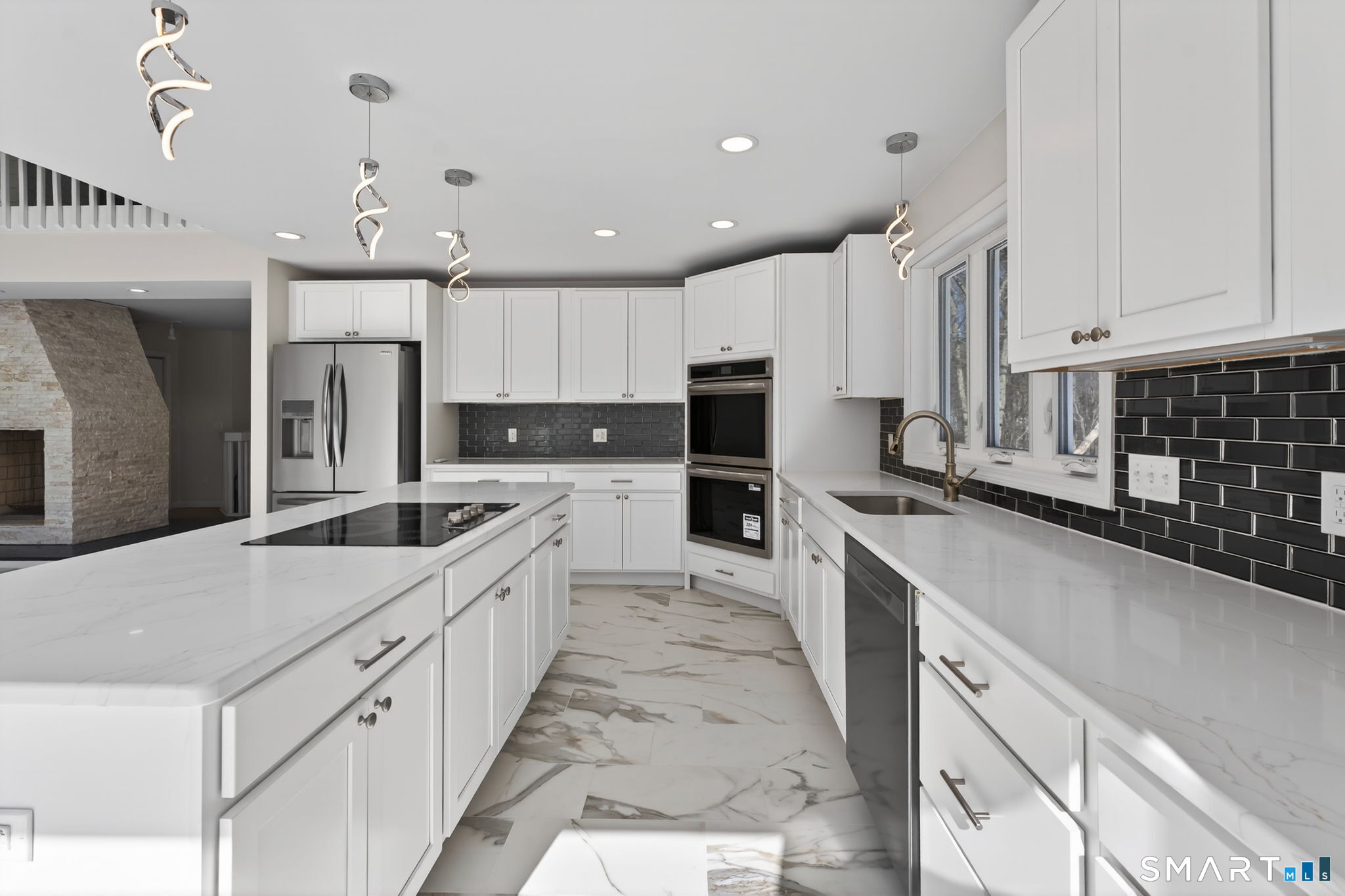 44 Chamberlain Hill Road Middletown, CT 06457 - Photo 6 of 40 a large kitchen with stainless steel appliances kitchen island granite countertop a refrigerator a stove a sink and white cabinets with wooden floor