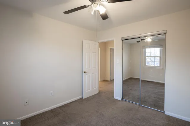 an empty room with fan