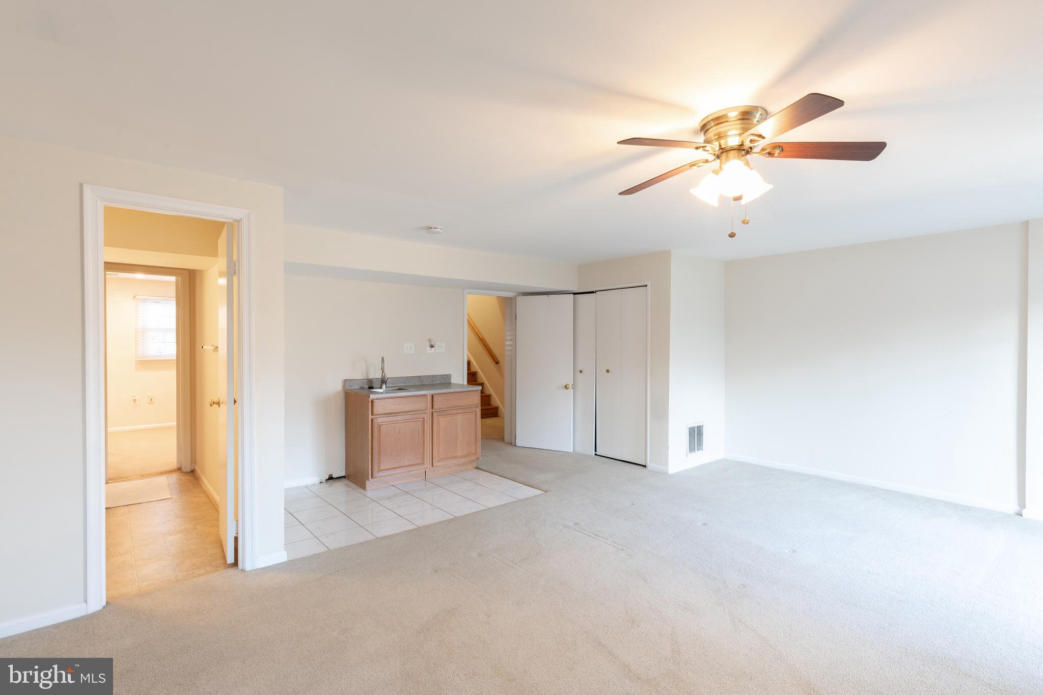 8132 Sleepy View Lane Springfield, VA 22153 - Photo 24 of 31 a view of a room with chandelier fan and windows