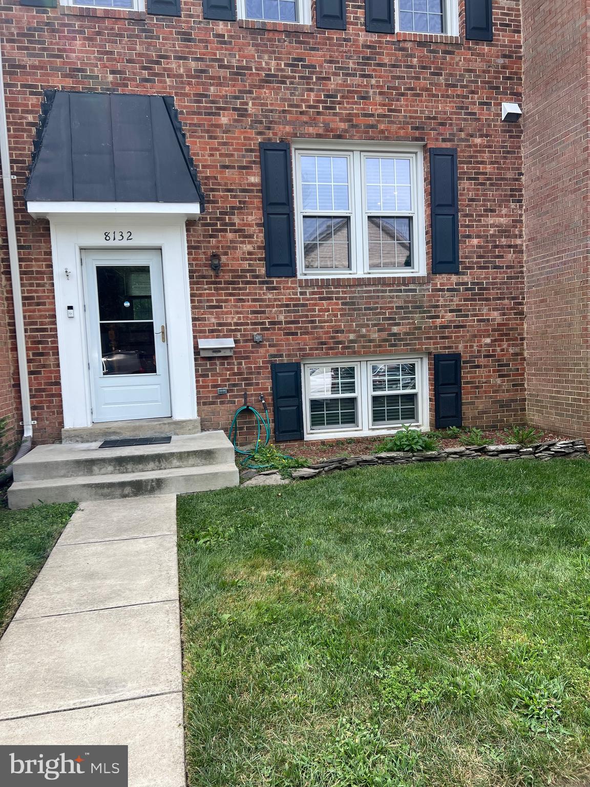 8132 Sleepy View Lane Springfield, VA 22153 - Photo 31 of 31 a view of a brick house with a yard
