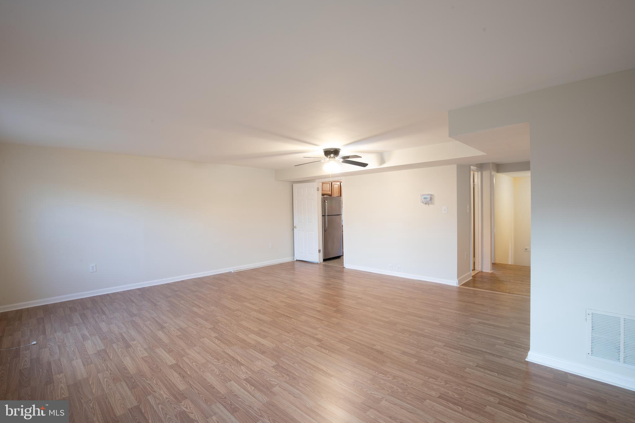 8132 Sleepy View Lane Springfield, VA 22153 - Photo 8 of 31 a view of an empty room with wooden floor