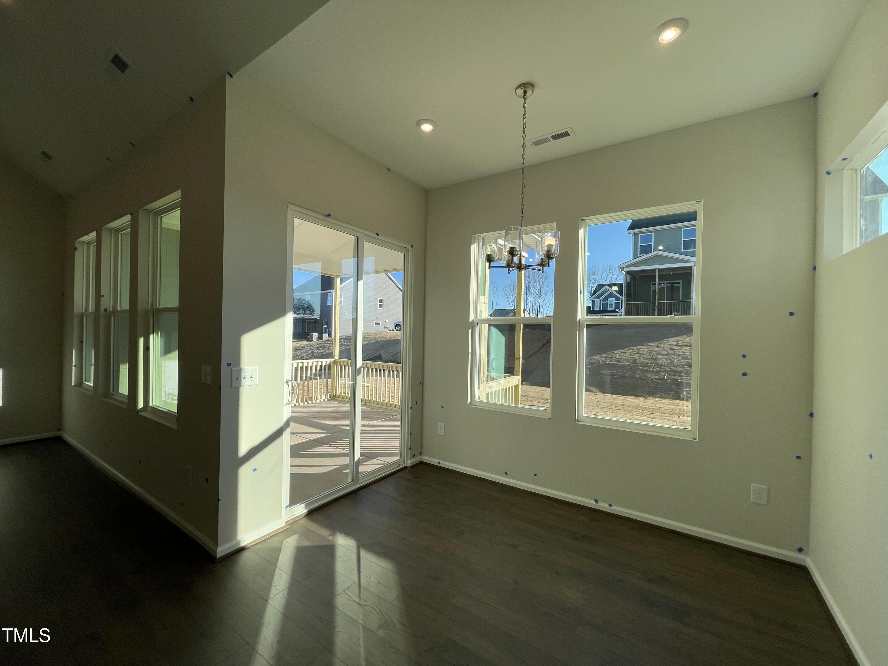 548 Marthas View Way Wake Forest, NC 27587 - Photo 12 of 44 wooden floor in an empty room with a window