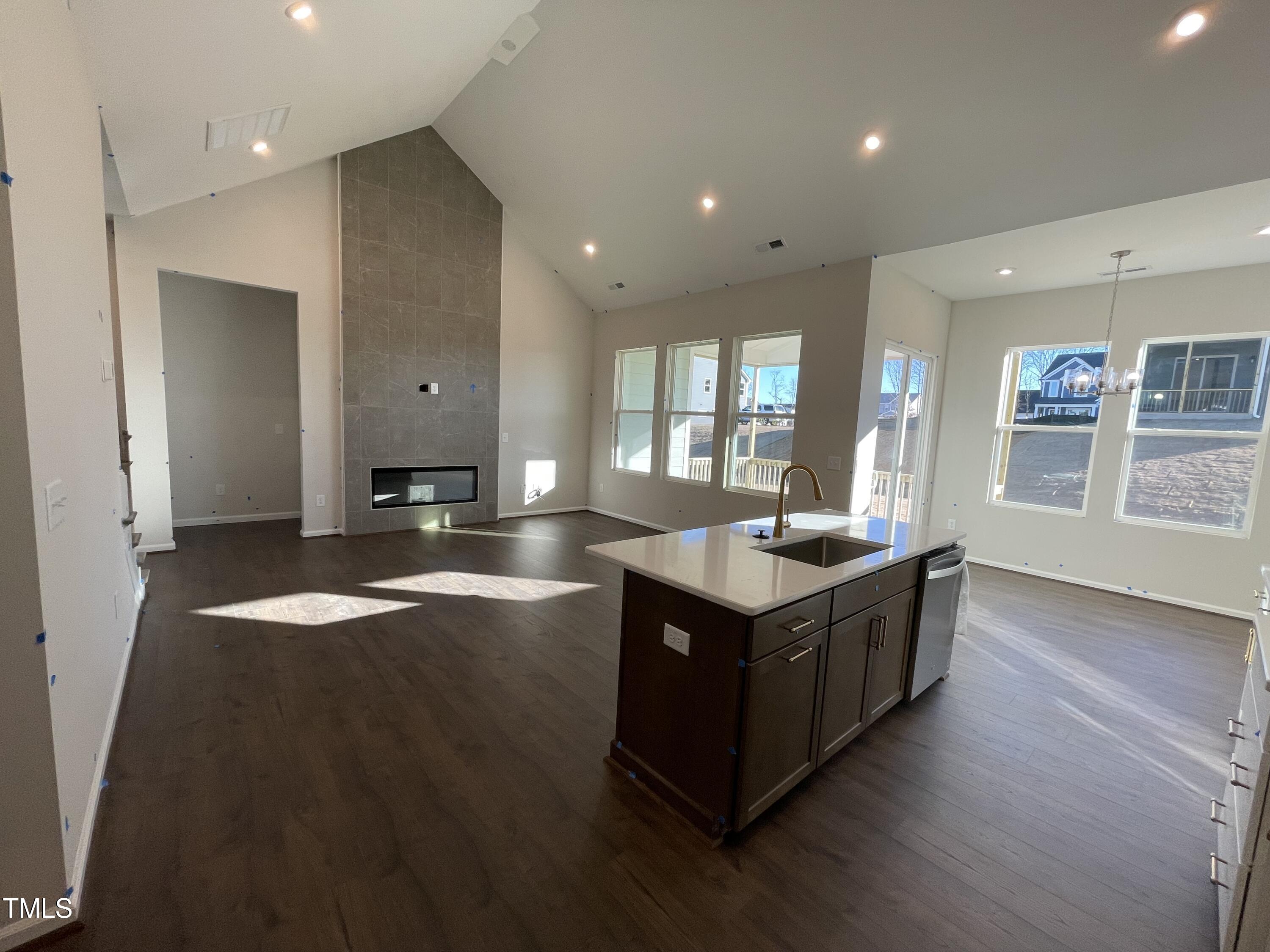 548 Marthas View Way Wake Forest, NC 27587 - Photo 13 of 44 an open kitchen with granite countertop a sink and a stove