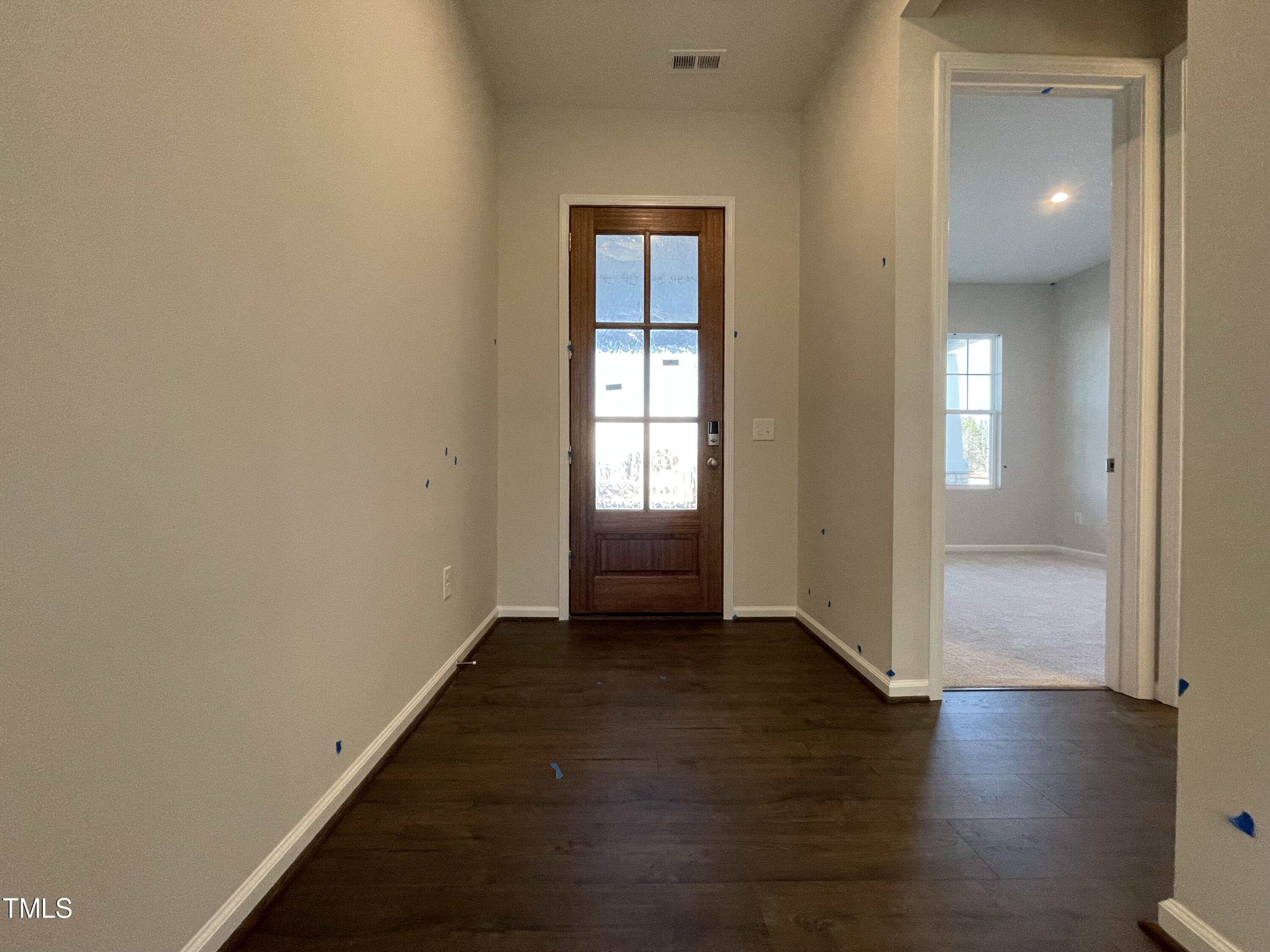 548 Marthas View Way Wake Forest, NC 27587 - Photo 3 of 44 an empty room with wooden floor and a window