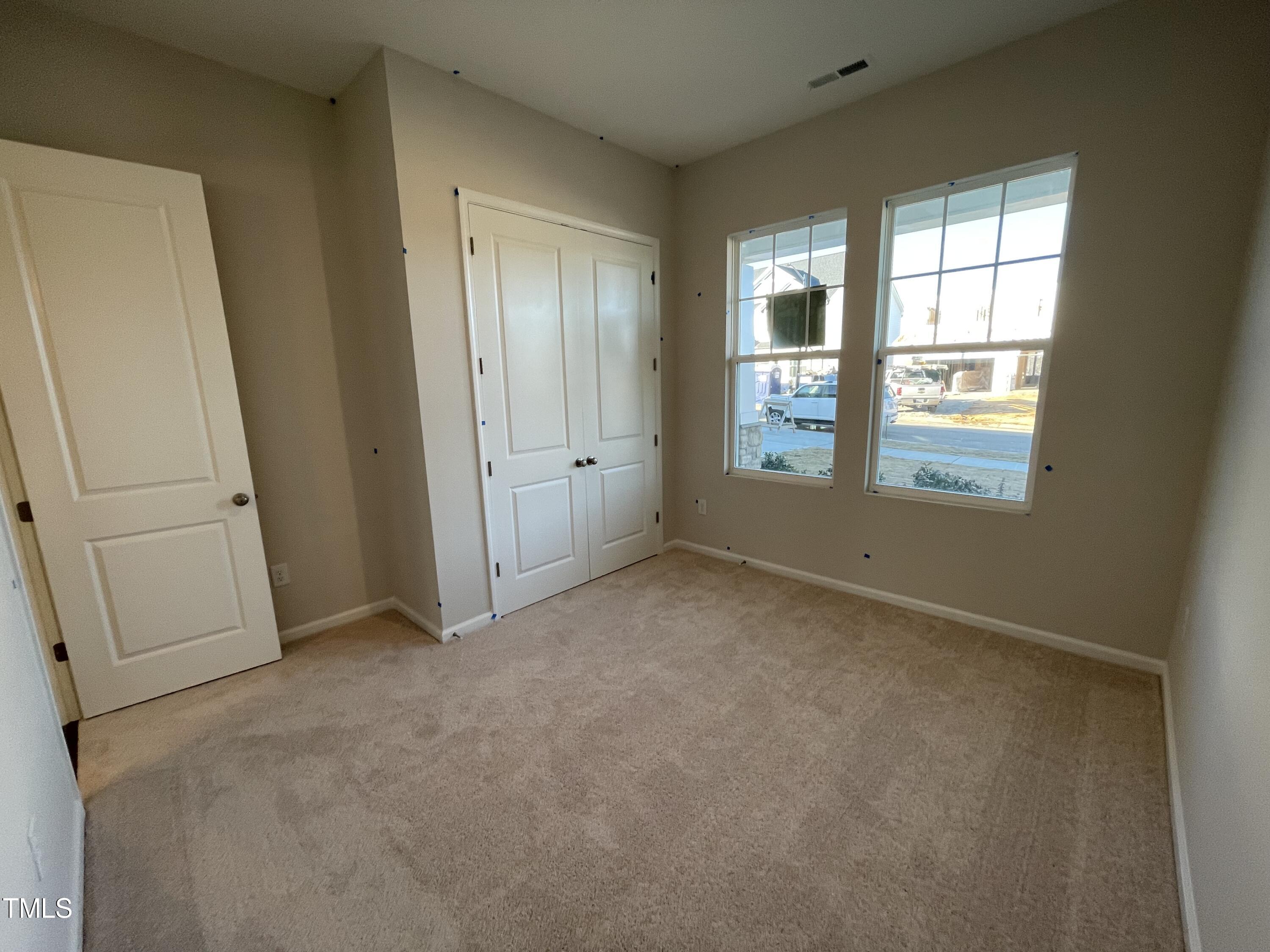 548 Marthas View Way Wake Forest, NC 27587 - Photo 5 of 44 an empty room with windows