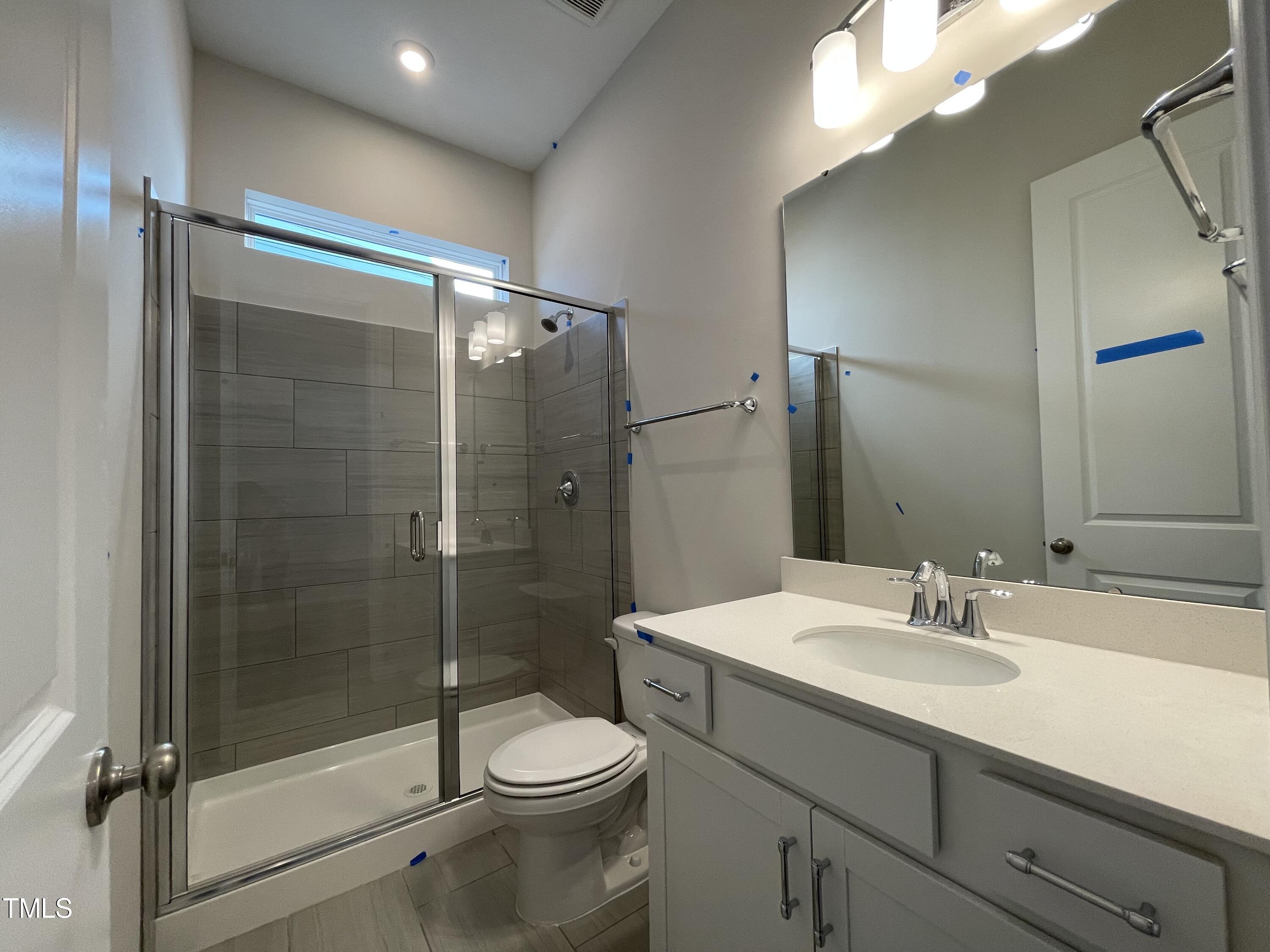 548 Marthas View Way Wake Forest, NC 27587 - Photo 6 of 44 a bathroom with a sink a toilet and shower