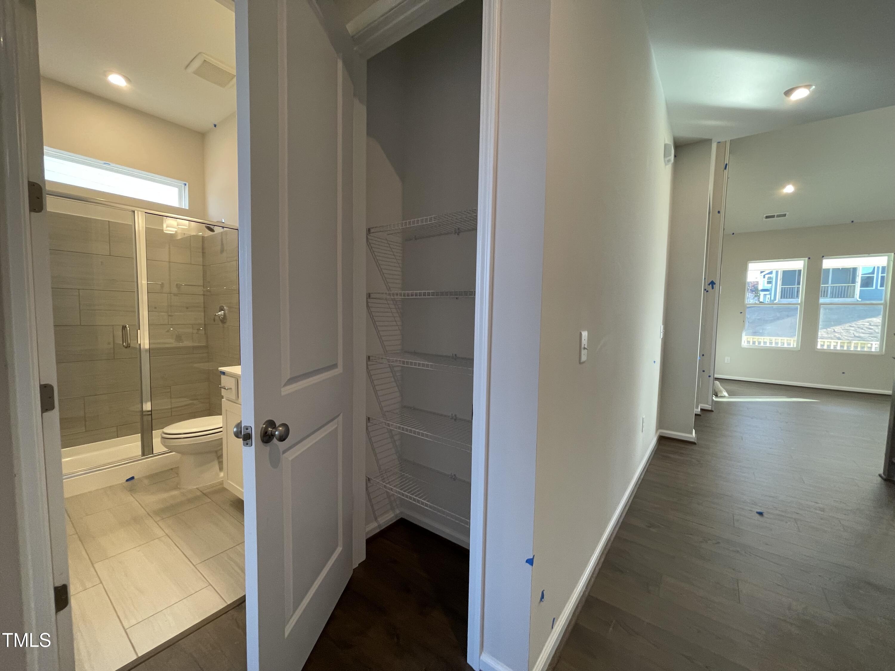 548 Marthas View Way Wake Forest, NC 27587 - Photo 7 of 44 a bathroom with a glass shower door