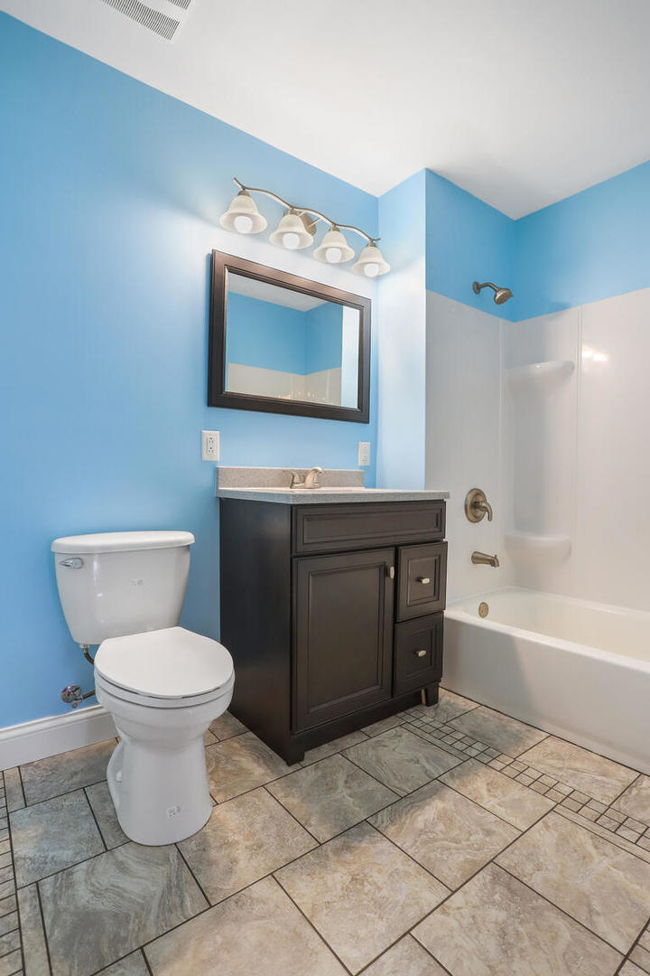1531 Collier Avenue Rantoul, IL 61866 - Photo 23 of 33 a bathroom with a toilet sink and mirror