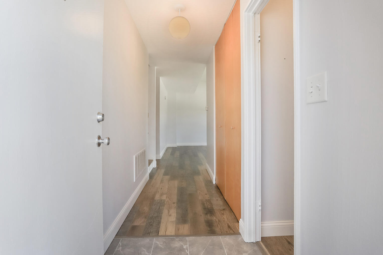 1531 Collier Avenue Rantoul, IL 61866 - Photo 4 of 33 a view of a hallway with wooden floor