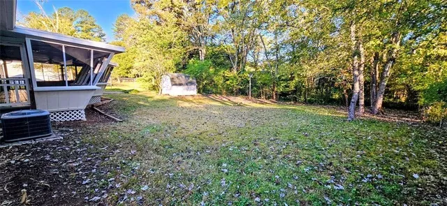 a backyard of a house with lots of green space