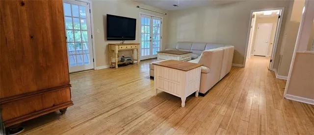 a living room with furniture and a flat screen tv