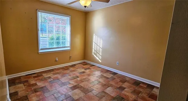 a view of an empty room and window