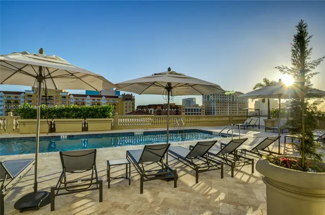 a view of swimming pool with outdoor seating