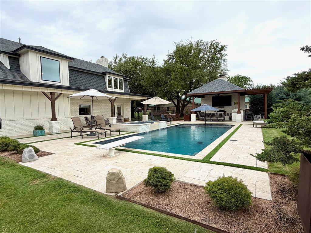 1304 Tinker Road Colleyville, TX 76034 - Photo 26 of 28 a view of a house with swimming pool and sitting area