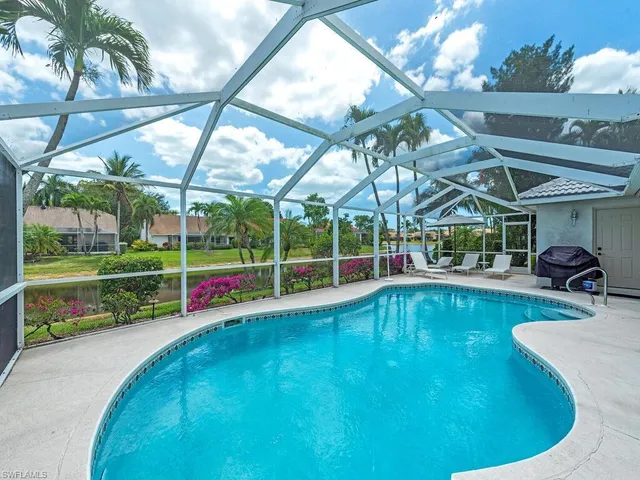 a view of a swimming pool with a porch in front of it