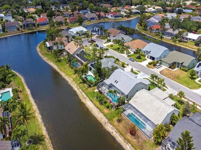 an aerial view of a house with a lake view