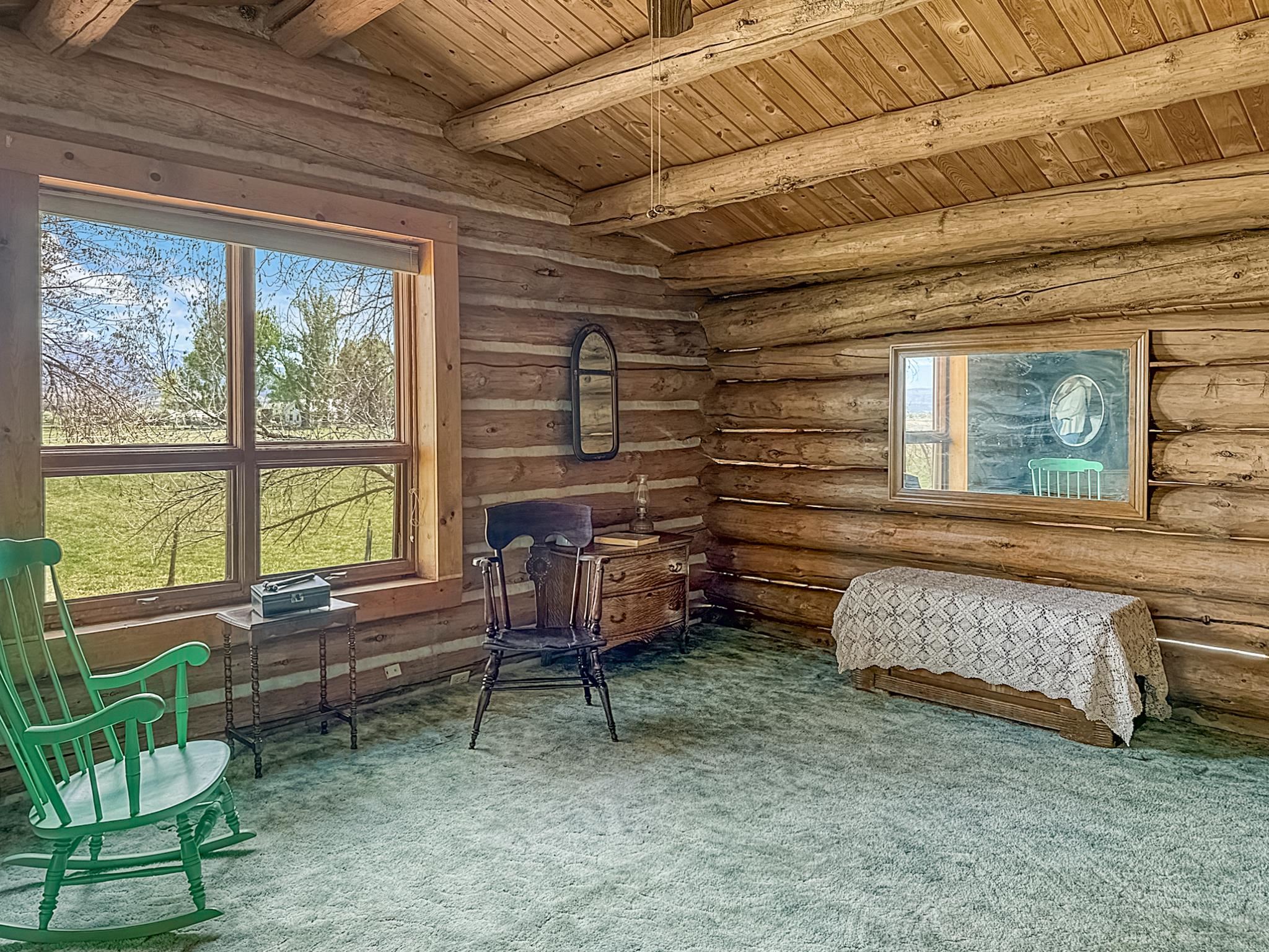 9709 3605 Road Hotchkiss, CO 81419 - Photo 8 of 42 a bedroom with furniture and a window