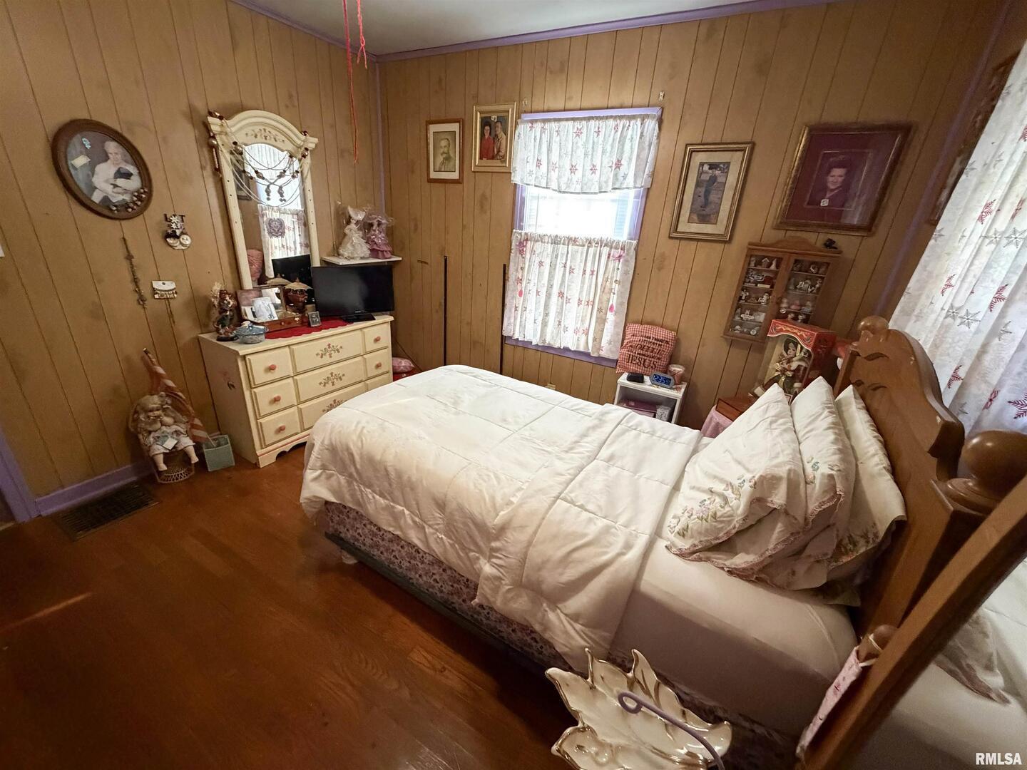 601 East Lafayette Street Olney, IL 62450 - Photo 16 of 45 a bedroom with a bed mirror and window
