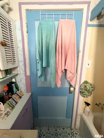 a bathroom with a bathtub and shower