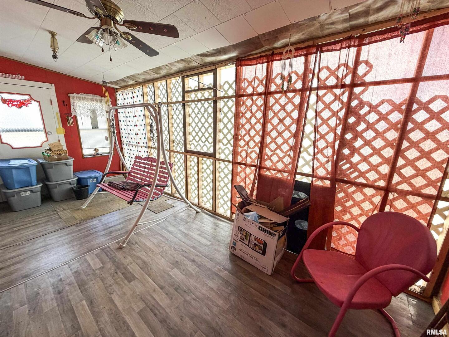 601 East Lafayette Street Olney, IL 62450 - Photo 26 of 45 a living room with furniture and floor to ceiling windows