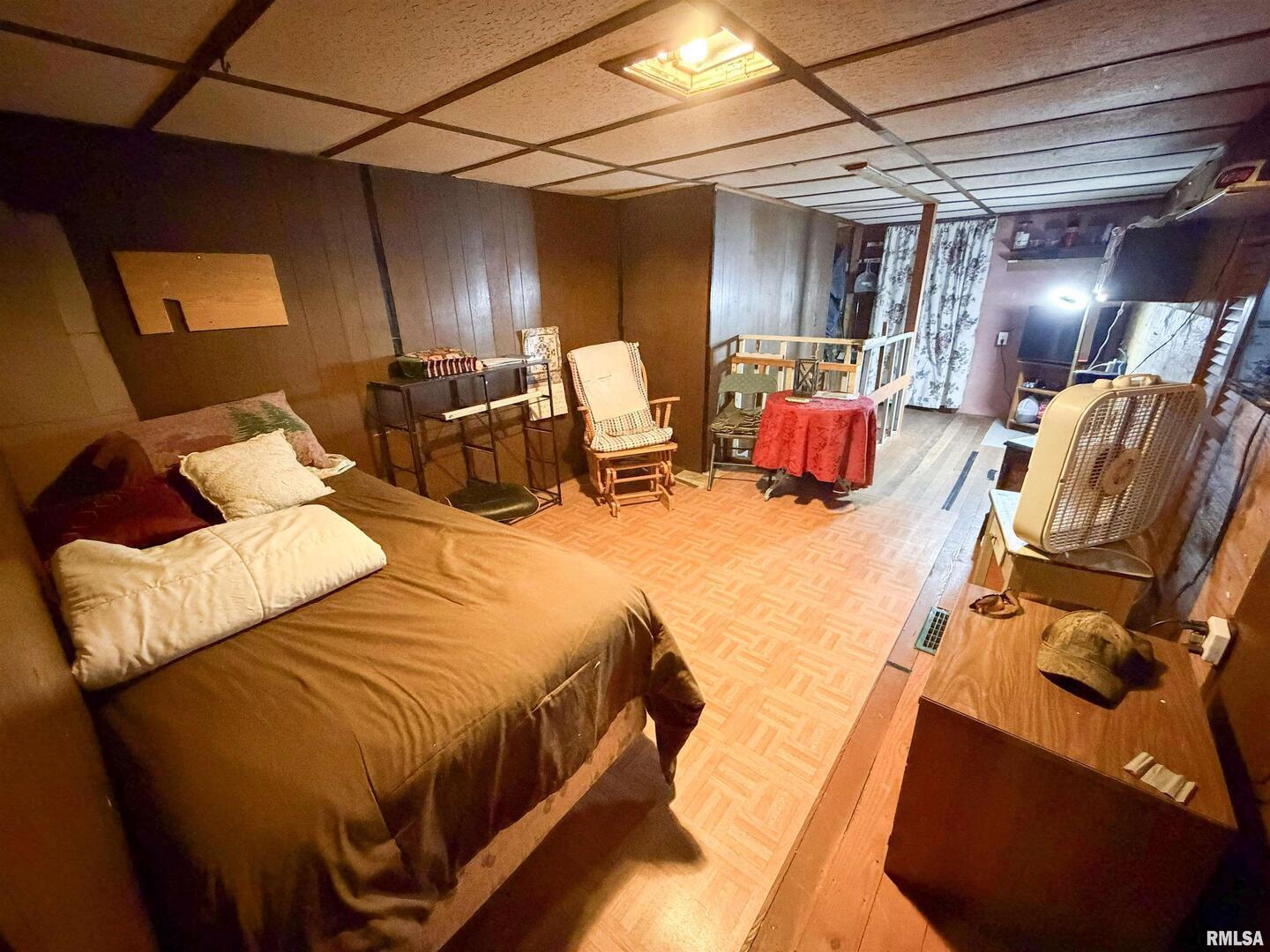 601 East Lafayette Street Olney, IL 62450 - Photo 28 of 45 a bed room with a bed and a chair