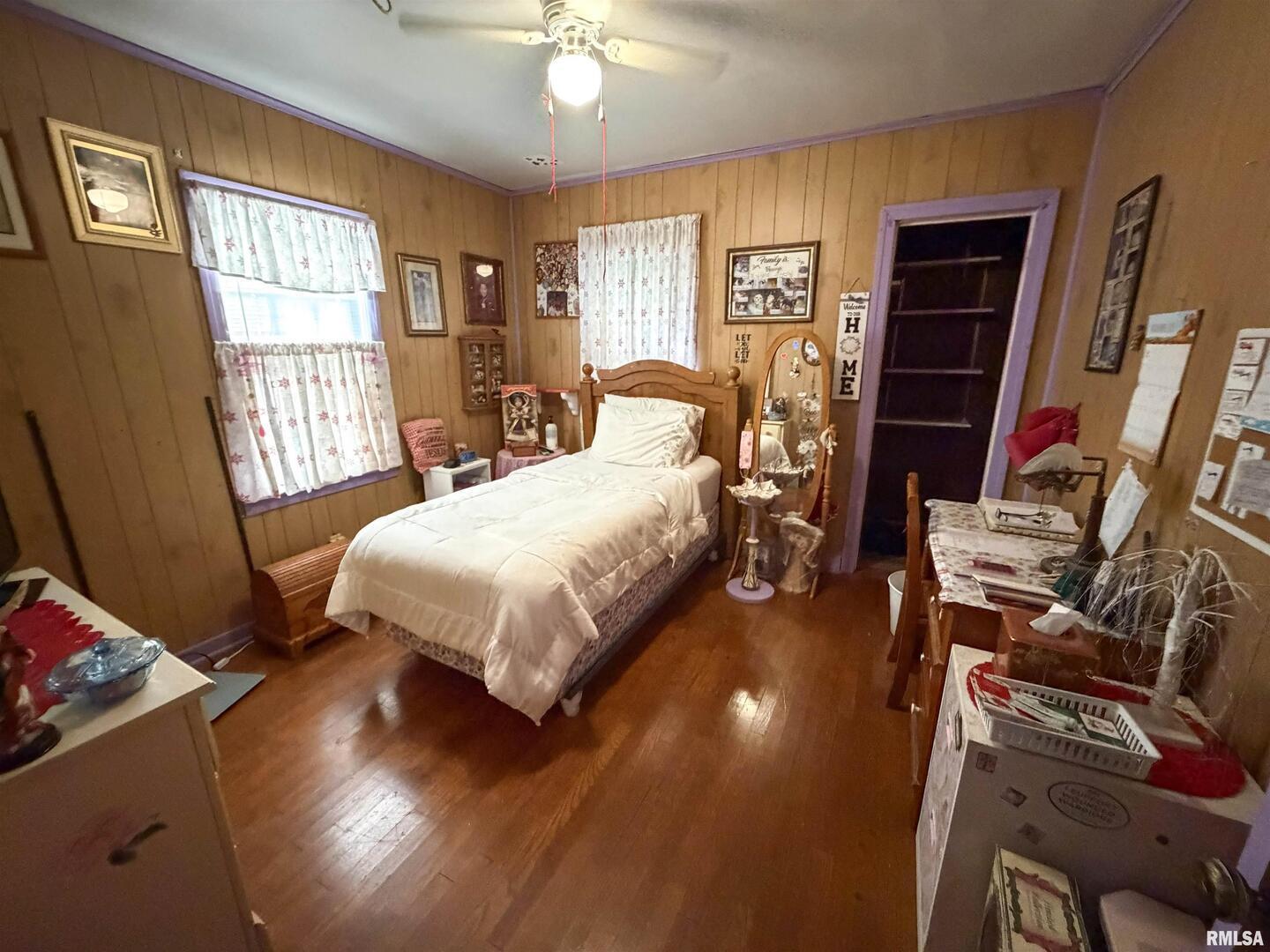 601 East Lafayette Street Olney, IL 62450 - Photo 5 of 45 a bedroom with a bed and wooden floor