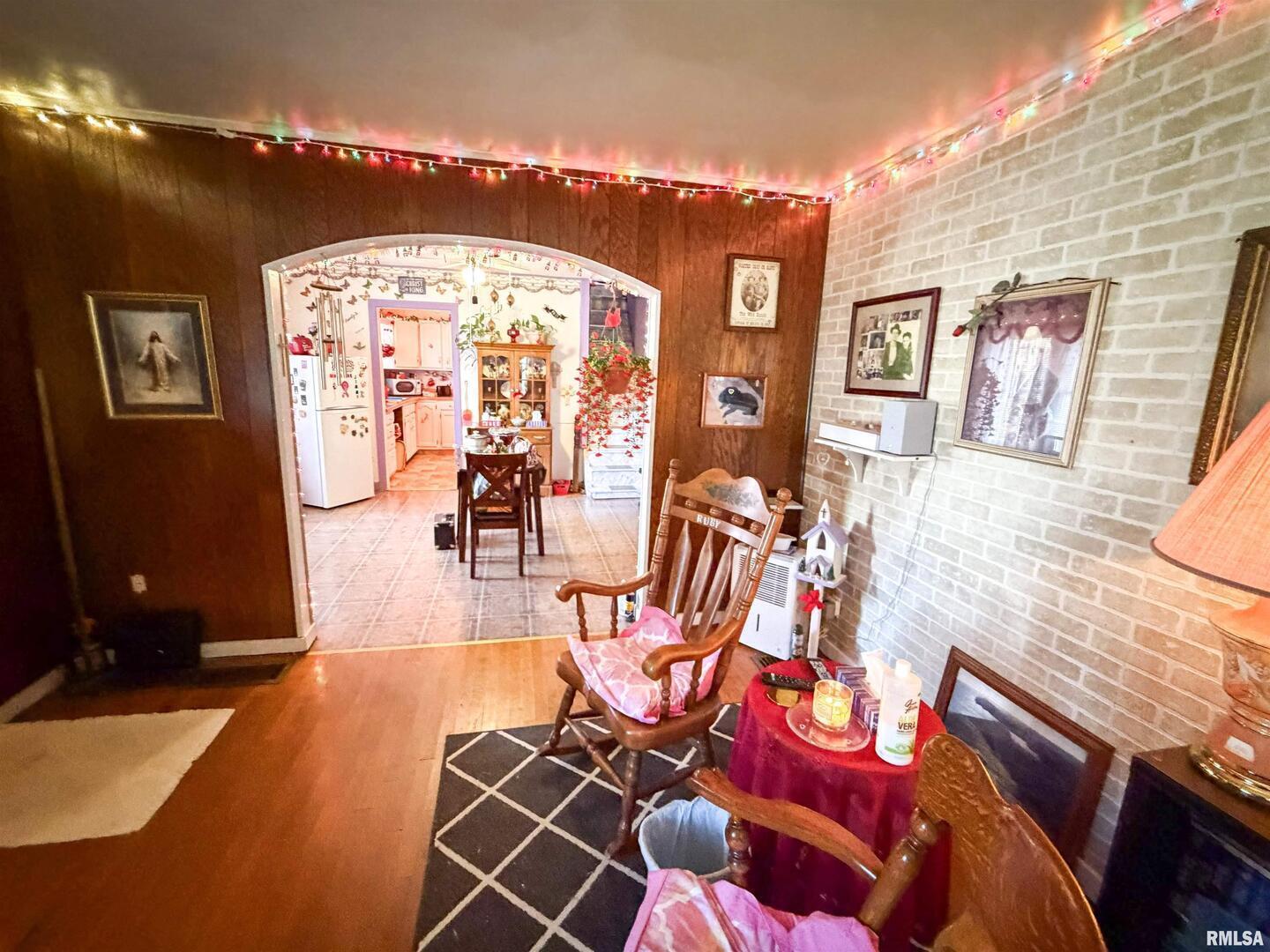 601 East Lafayette Street Olney, IL 62450 - Photo 8 of 45 a living room with furniture and a flat screen tv