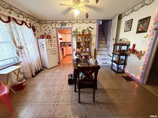 a view of a dining room with furniture window and chandelier