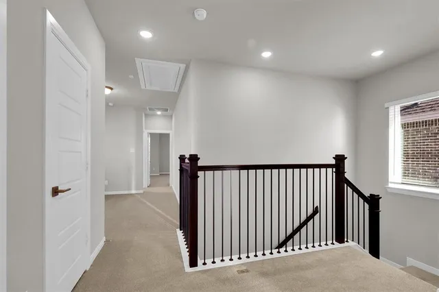 a view of a hallway with windows