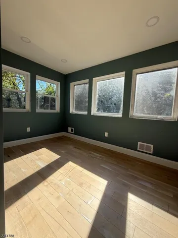 a view of a livingroom with furniture and a window
