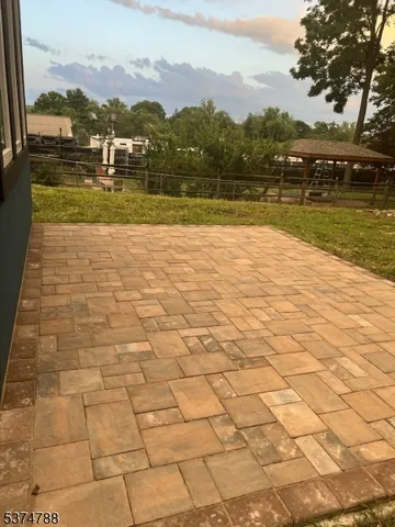 a kitchen with a sink a refrigerator and cabinets